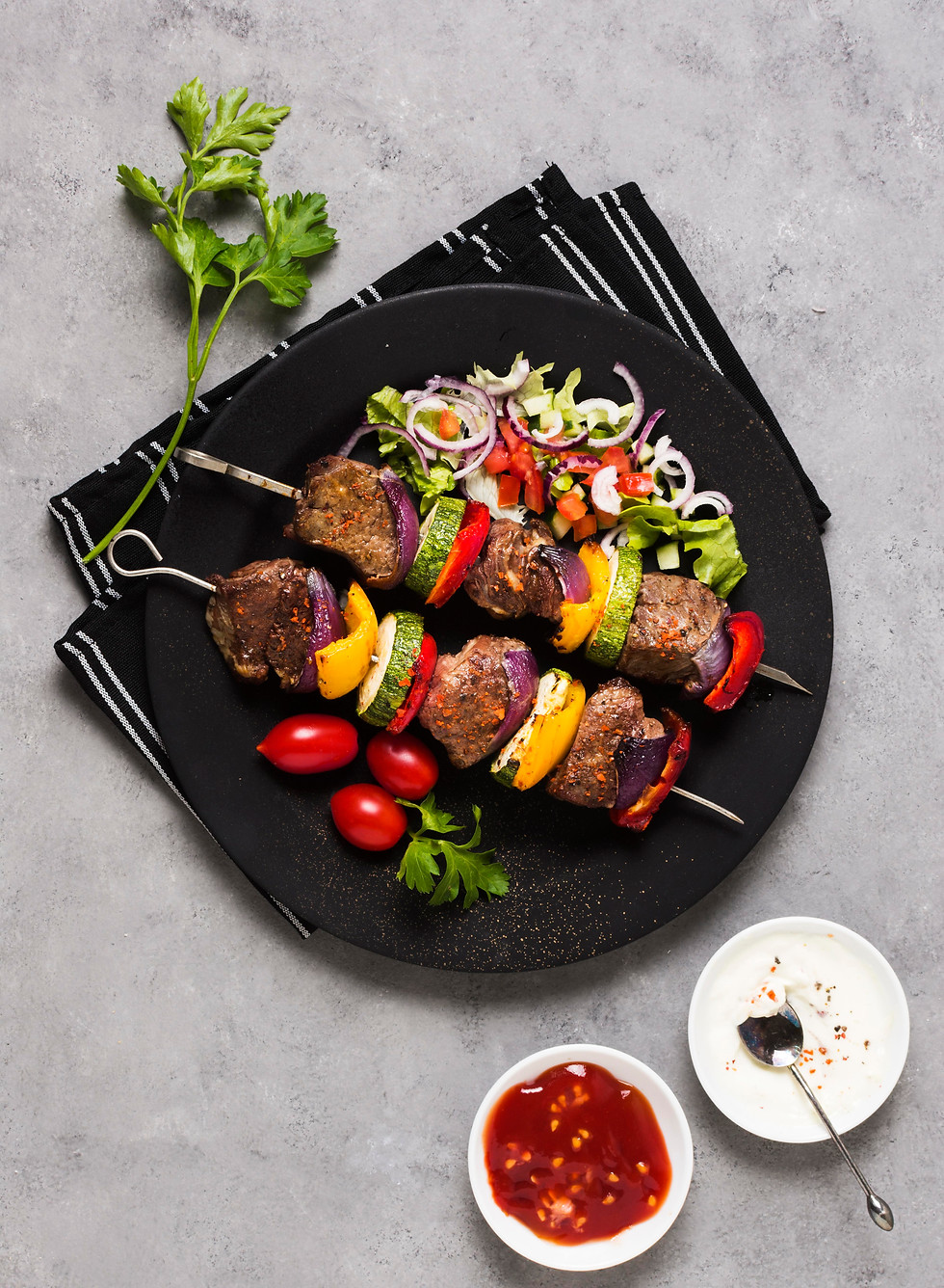 delicious-arabic-fast-food-skewers-black-plate.jpg