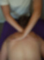 Client receiving myofascial release over the shoulder blades