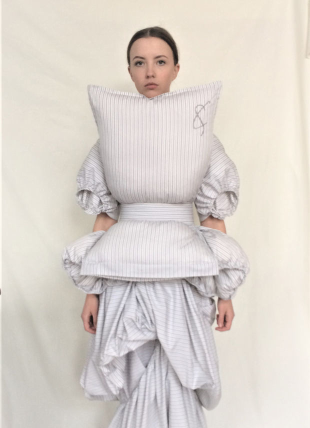 A model wearing the emotive pillow dress by Cunnington & Sanderson 2018 to raise mental health awareness