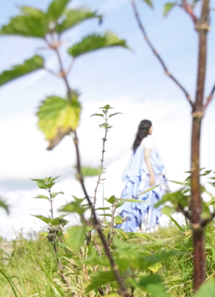 model in the Yorkshire countryside wearing high fashion bespoke gown for sustainable exhibition