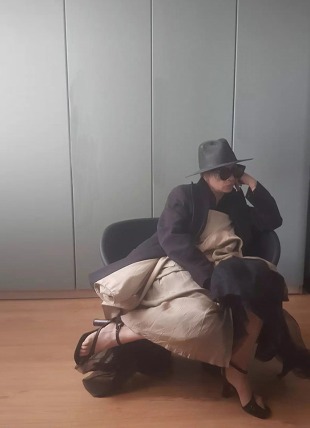 stylist in a chair showing her emotions