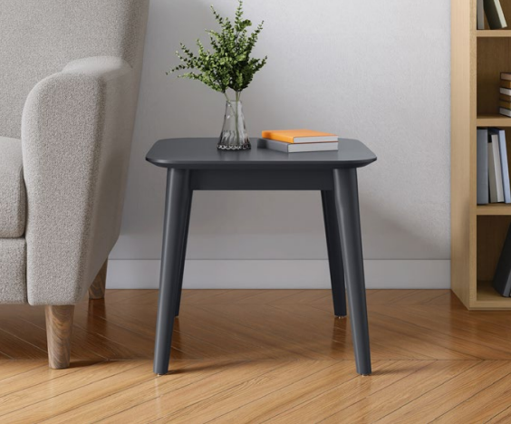 Frappe black side table with plant and books