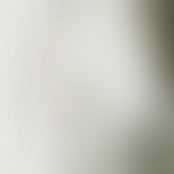 White lace wedding dress hanging up.