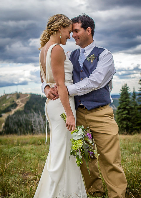 Love session of a couple photographed outdoors in Sandpoint, North Idaho during their wedding, capturing intimate moments, joyful expressions, and the beauty of the natural surroundings