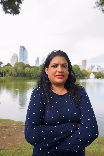 portrait-mature-indian-woman-relaxing-park_251136-10995.avif