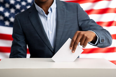 african-american-man-holds-envelope-in-hand-above-vote-ballot-xxl.jpg
