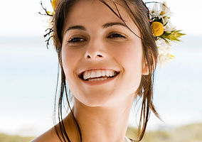 a woman smiling after recieving bhrt treatment at a practice that also offers trt, glp-1s, and cocierge medicine in vero beach