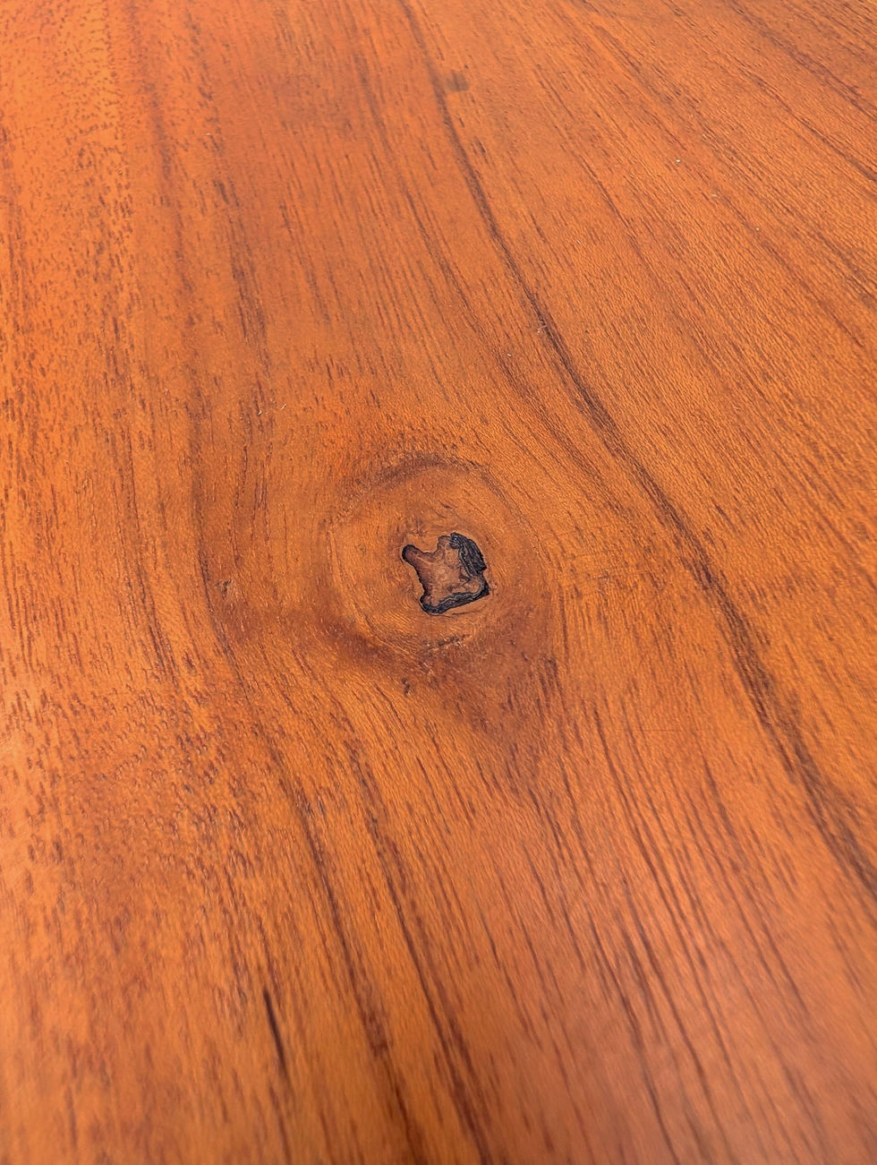 Thumbnail: Artisan-crafted teak chopping board with a circular grip opening