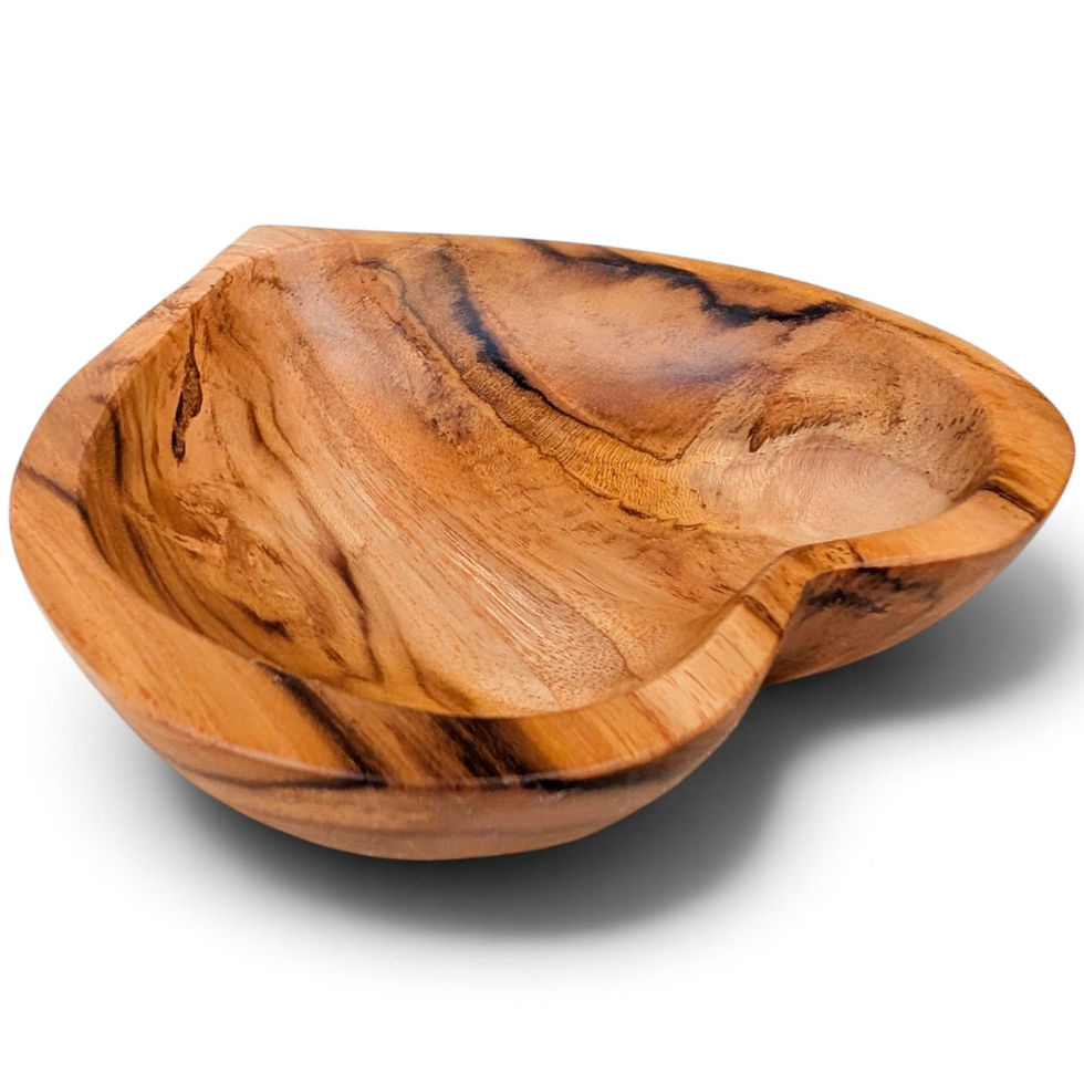 Hand-carved teak heart bowl with warm amber wood tones