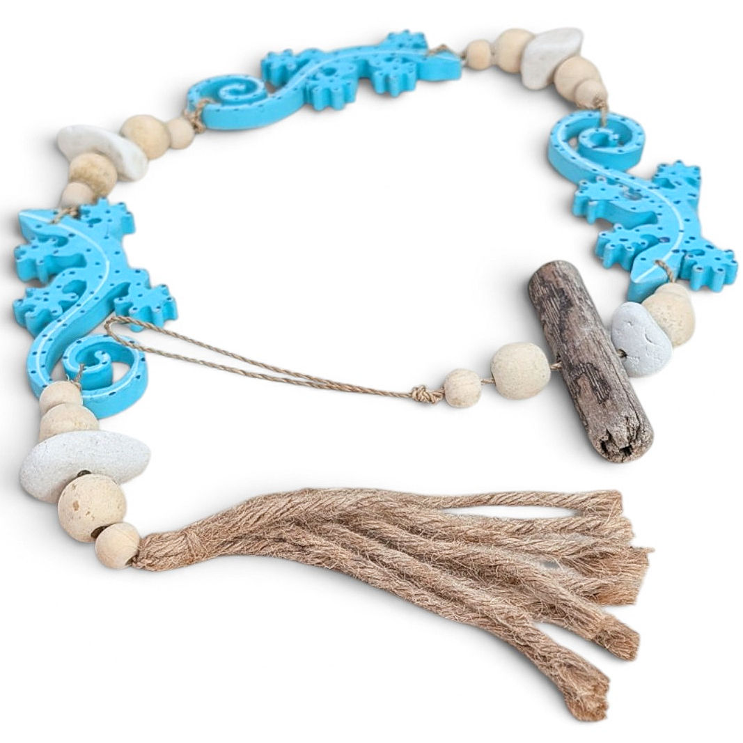 Hand-carved blue gecko wall hanging with assorted wooden beads