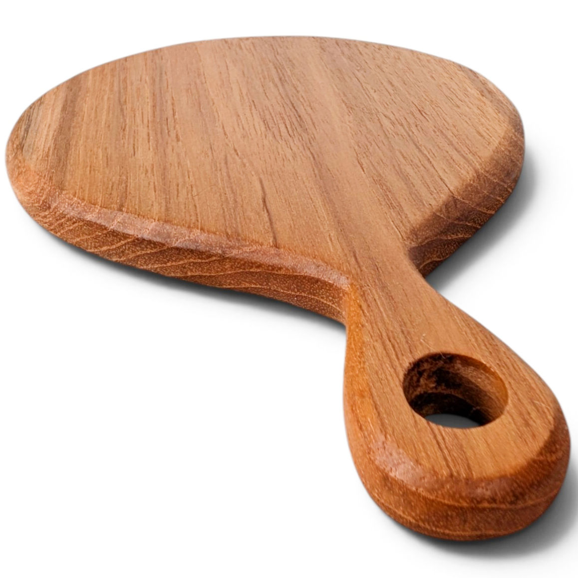 Solid teak serving paddle with a rounded board and wooden handle