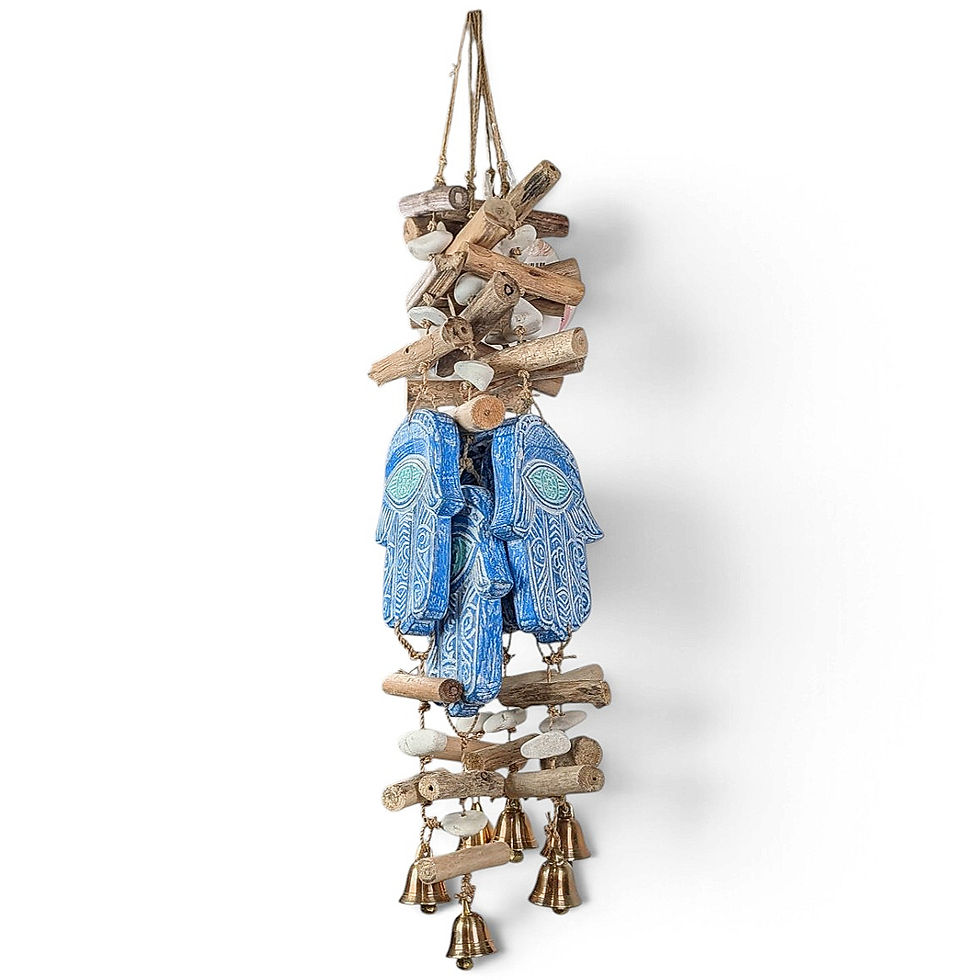 Blue Hamsa wall hanging with etched eye pattern and driftwood logs.