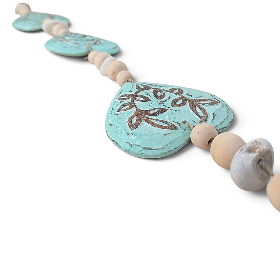 Thumbnail: Three tiered turquoise wooden hearts hanging vertically on a twine cord.