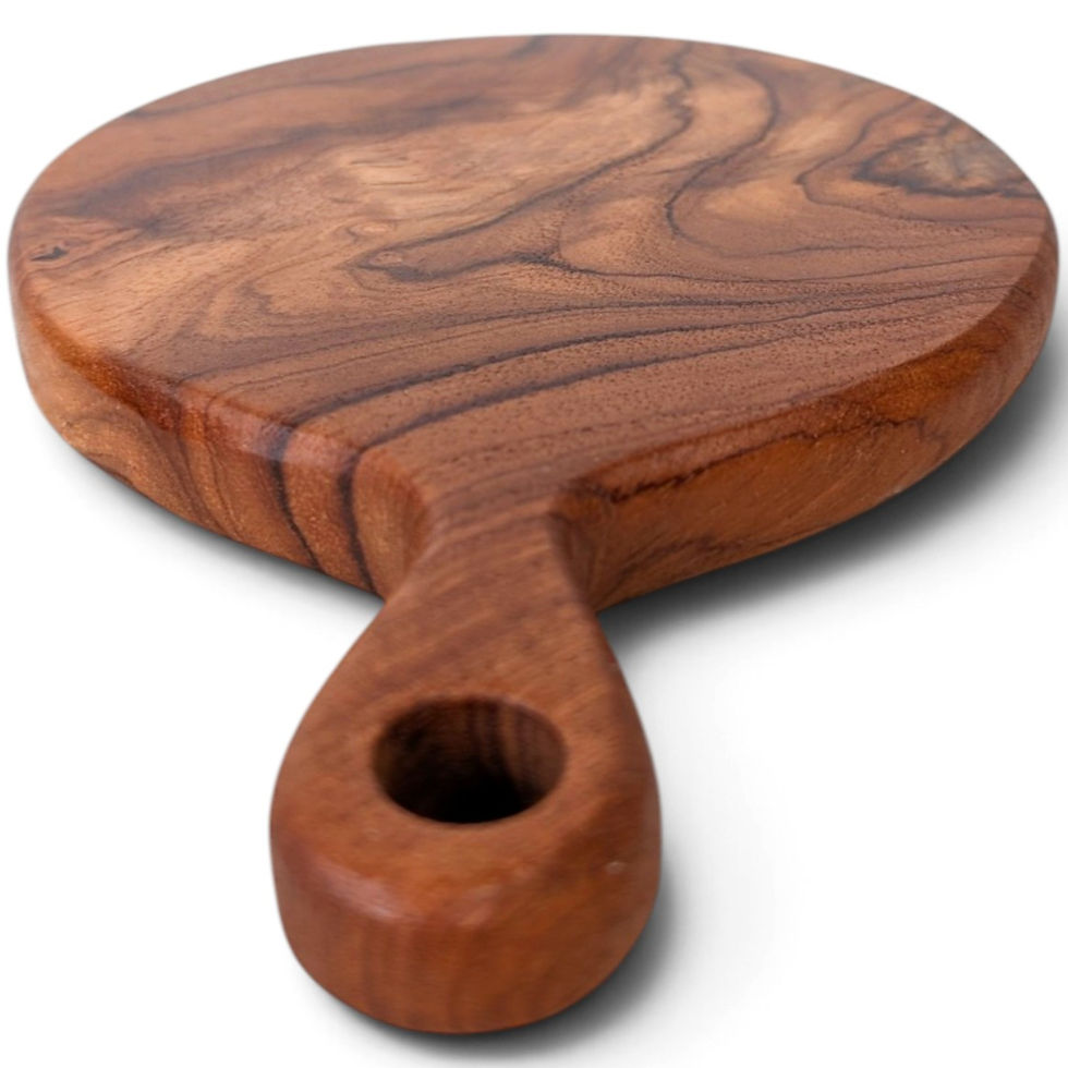 Carved teak serving board viewed from above