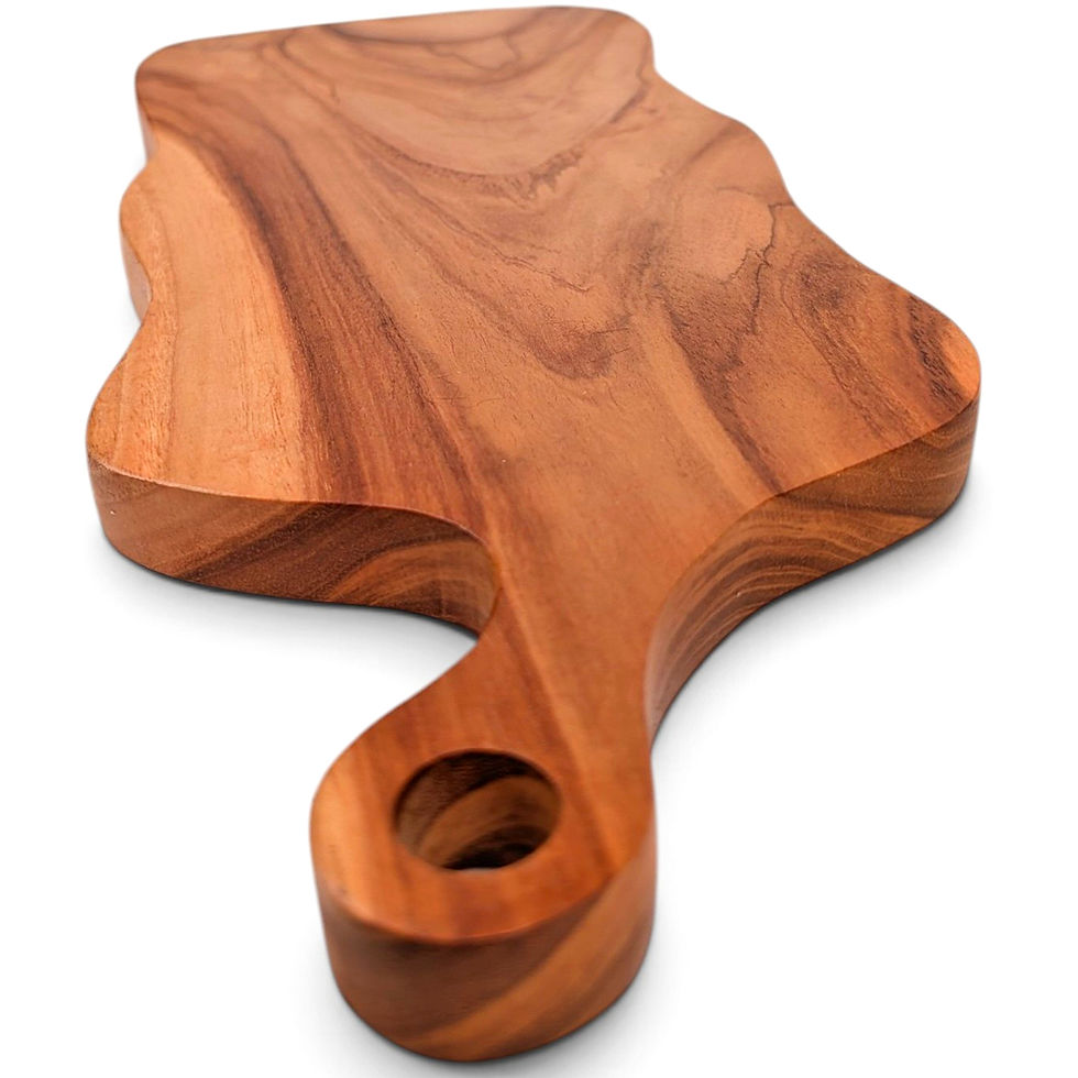 A teak cutting board with a live edge.