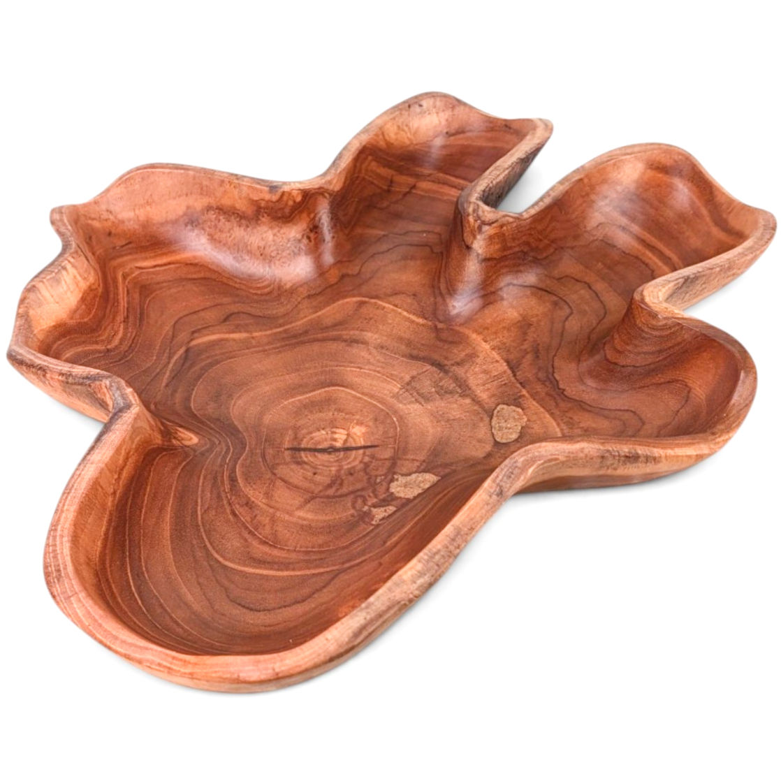 Handcrafted wood centerpiece with a bold organic silhouette