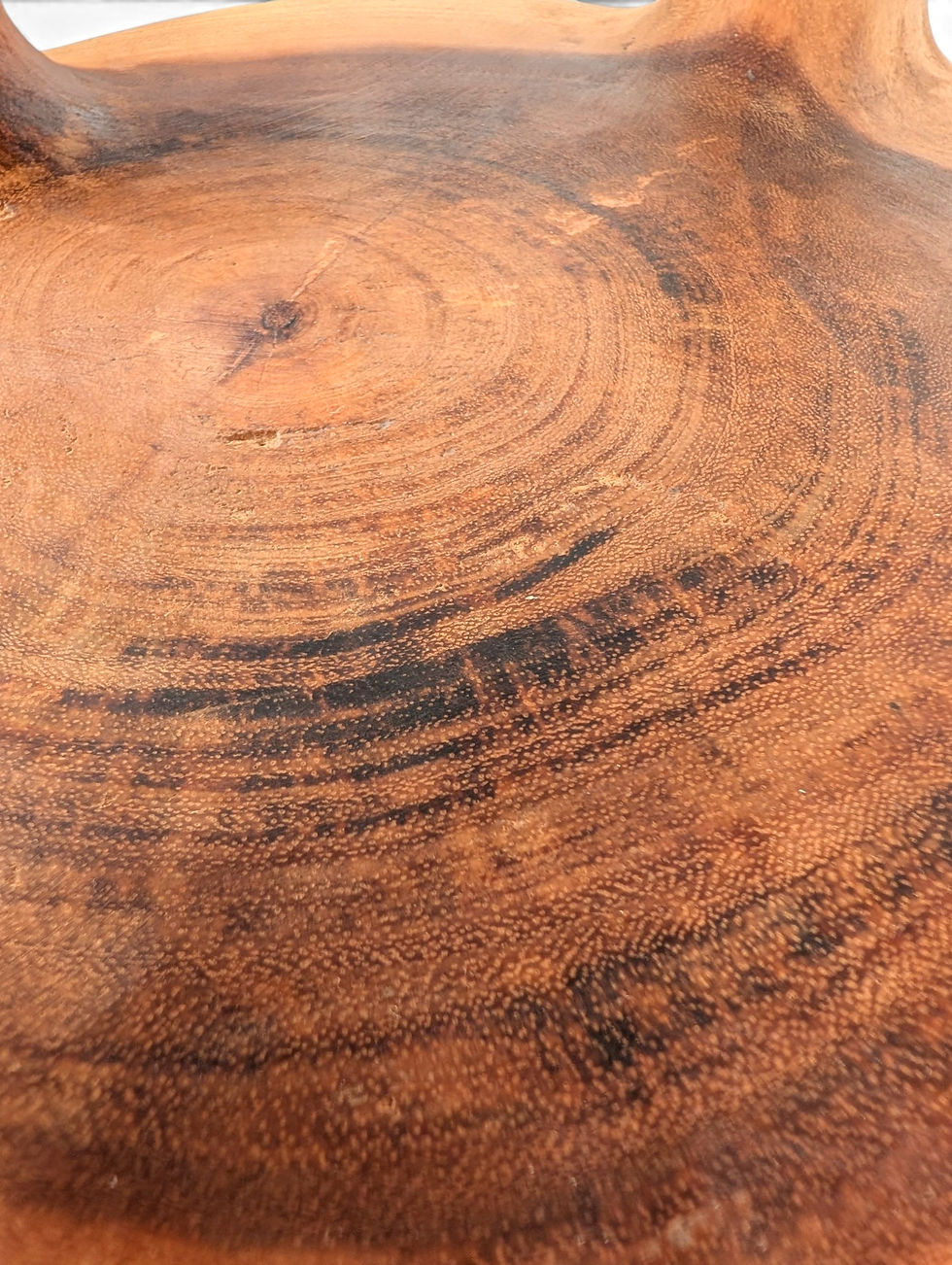 Thumbnail: Wooden stool with intersecting curved supports and a rounded base.