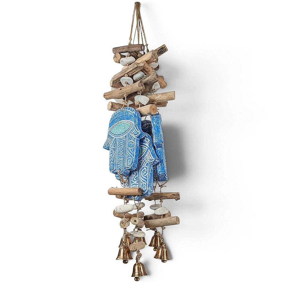 Blue Hamsa wall hanging with etched eye pattern and driftwood logs.