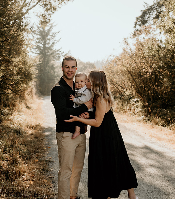 family on trail holding baby