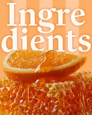 Orange slice and honey dripping over a fresh honeycomb with ingredients text background.