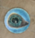 Hand painted geode ceramic coaster on blue background