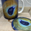 Thumbnail: Matching Mug and coaster set Coaster of painted shell on purple and gold background