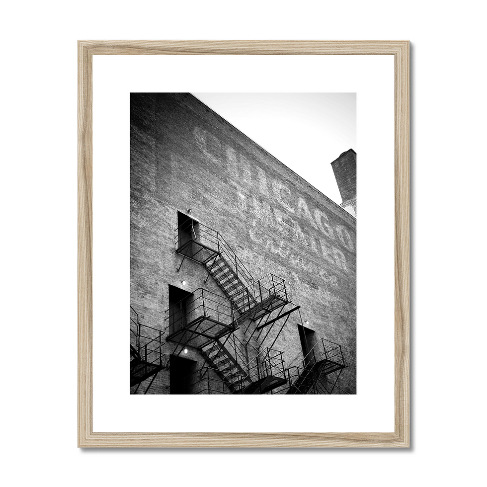 Thumbnail: Black and white photo of the Chicago Theatre stage door entrance with iron fire escapes and ghost sign.