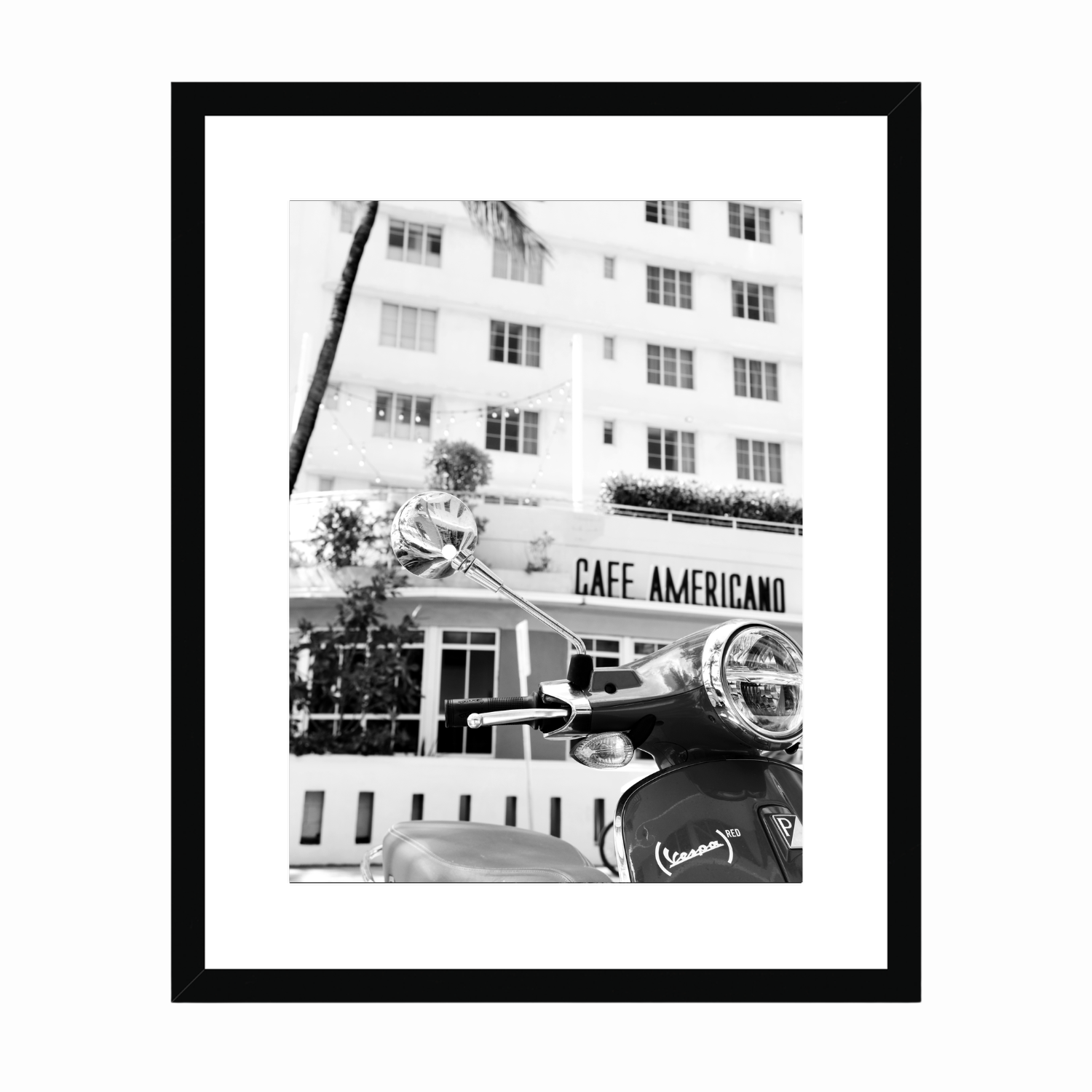 Vintage Vespa in front of the Cafe Americano art deco building in Miami