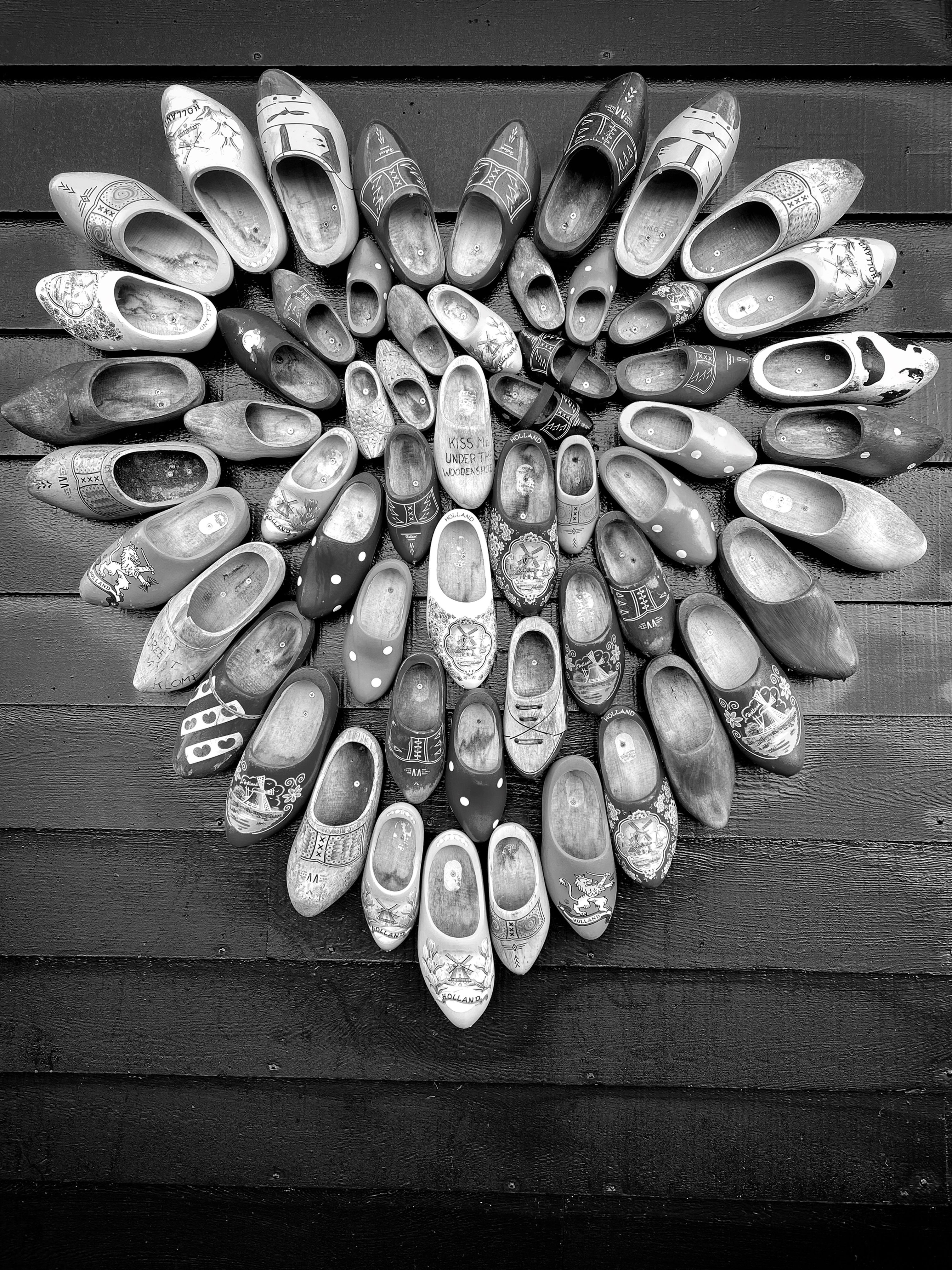 Black and white photo print of Dutch Love Clogs in a heart shape in the Netherlands