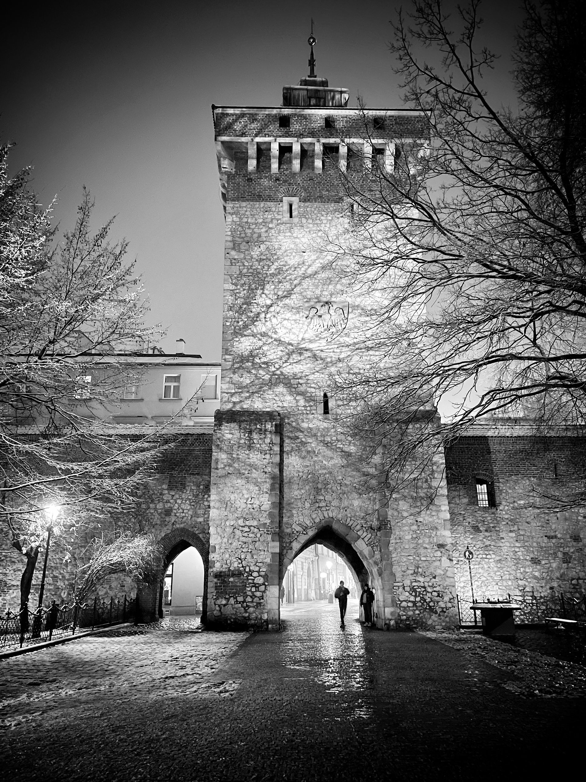 St Florian's gate in the snow, Krakow, Poland | Black and white travel photography | Limited edition wall art prints | Travel blog | © kpm photo art