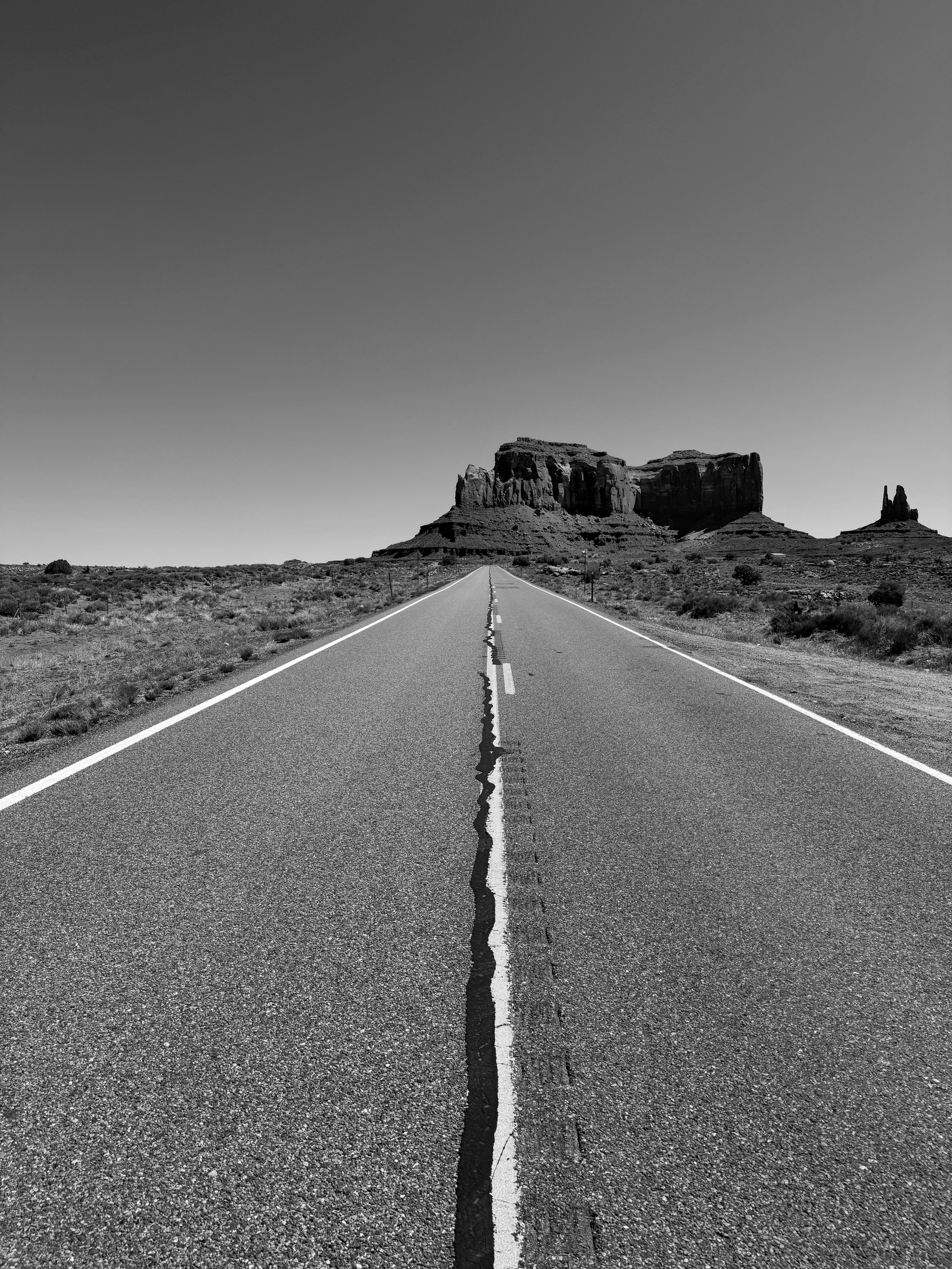 Black and white photo print of landscape and single road near Monument Valley, Arizona