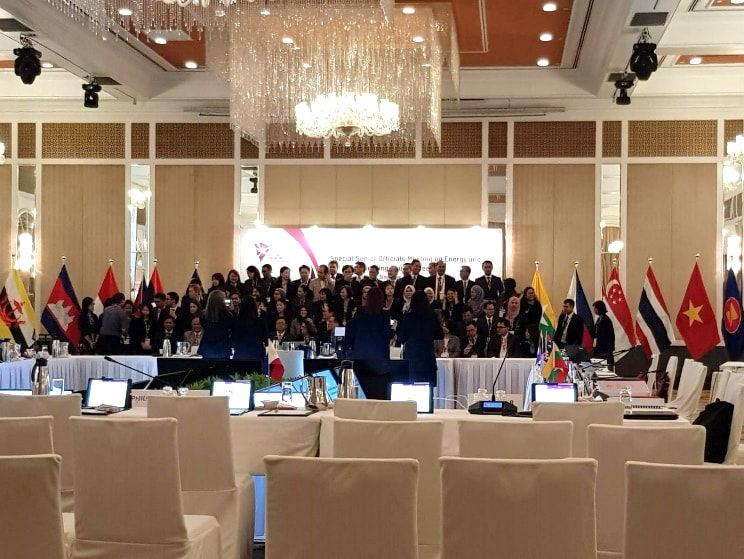 leaders in group with microphones on table