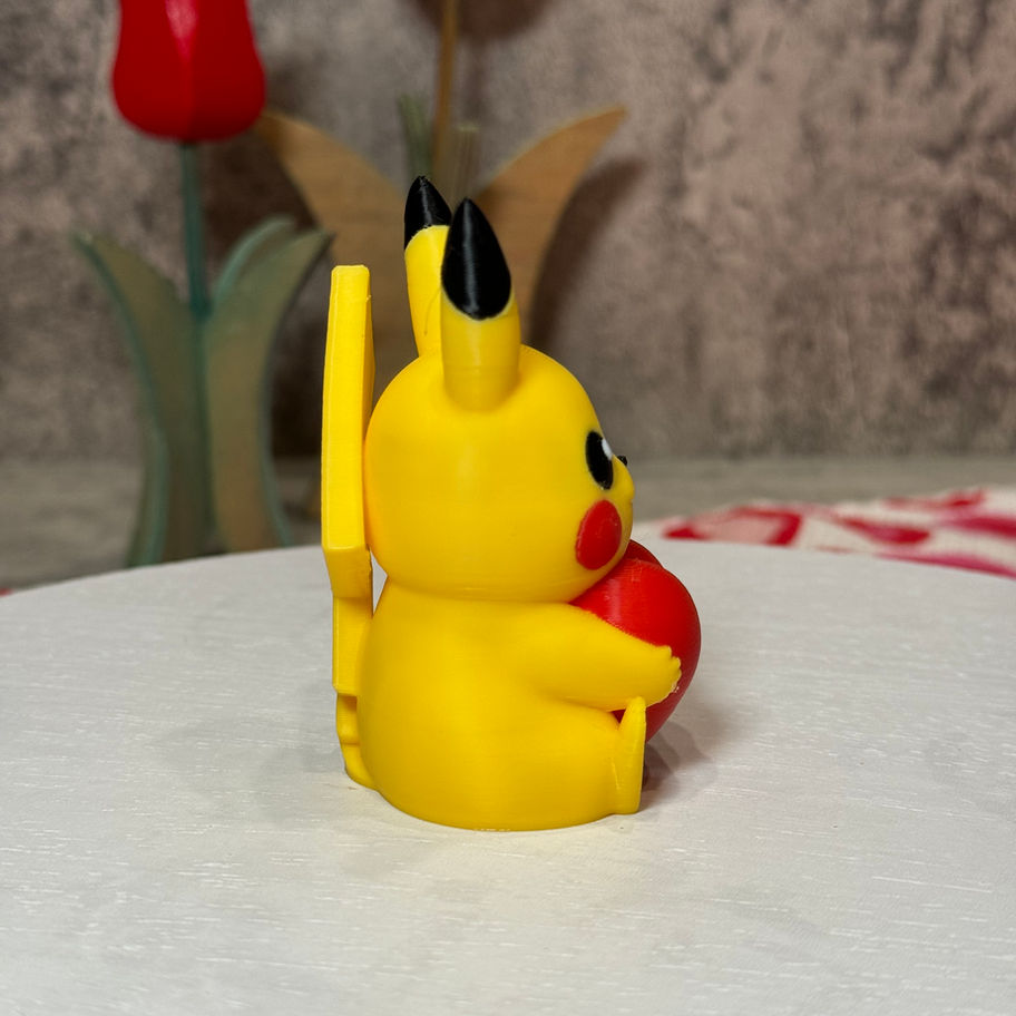 Adorable Pikachu holding a bright red heart, radiating love and sweetness—perfect for Valentine’s gifts or desk decor!