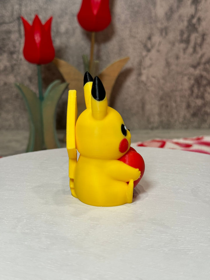 Adorable Pikachu holding a bright red heart, radiating love and sweetness—perfect for Valentine’s gifts or desk decor!