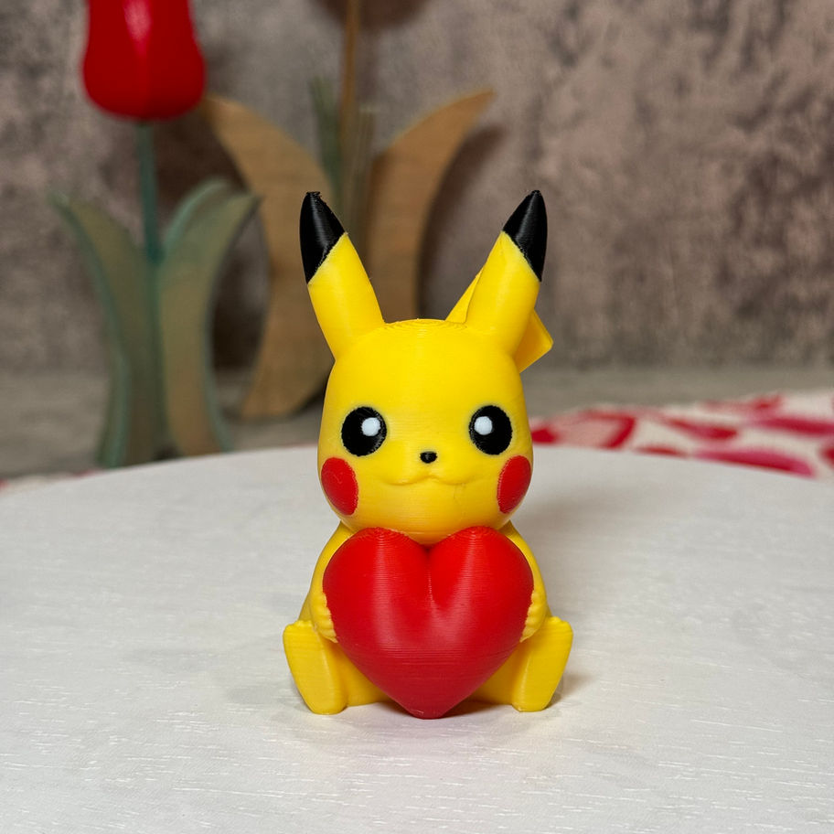 Adorable Pikachu holding a bright red heart, radiating love and sweetness—perfect for Valentine’s gifts or desk decor!
