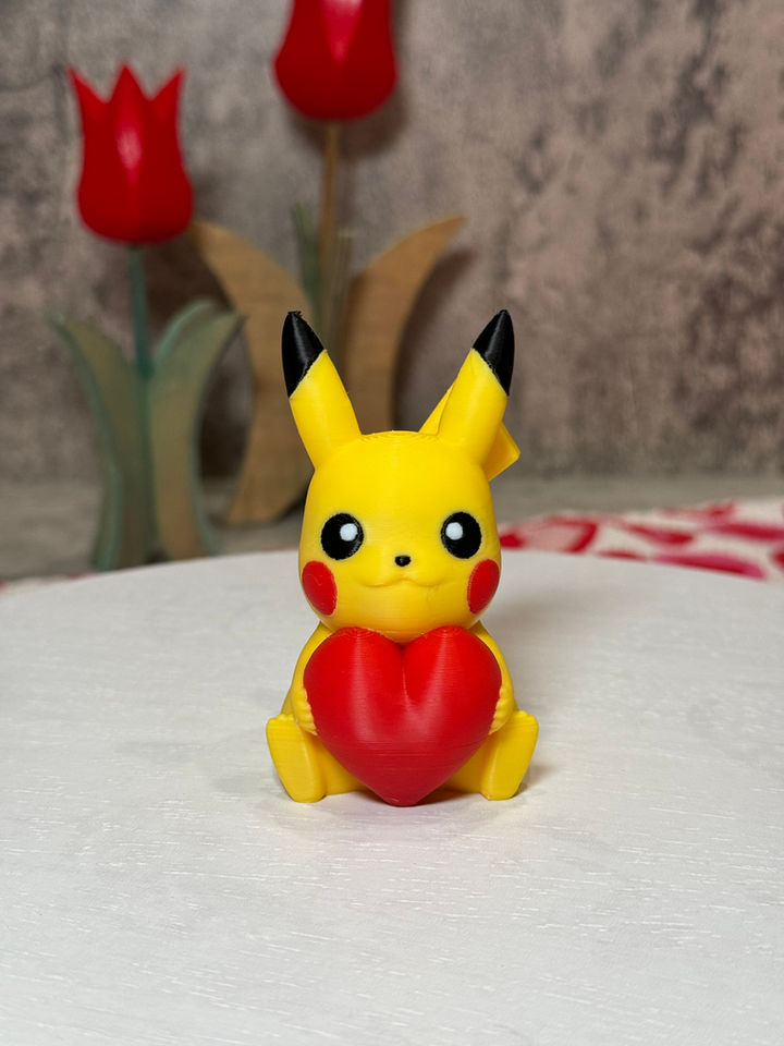 Adorable Pikachu holding a bright red heart, radiating love and sweetness—perfect for Valentine’s gifts or desk decor!