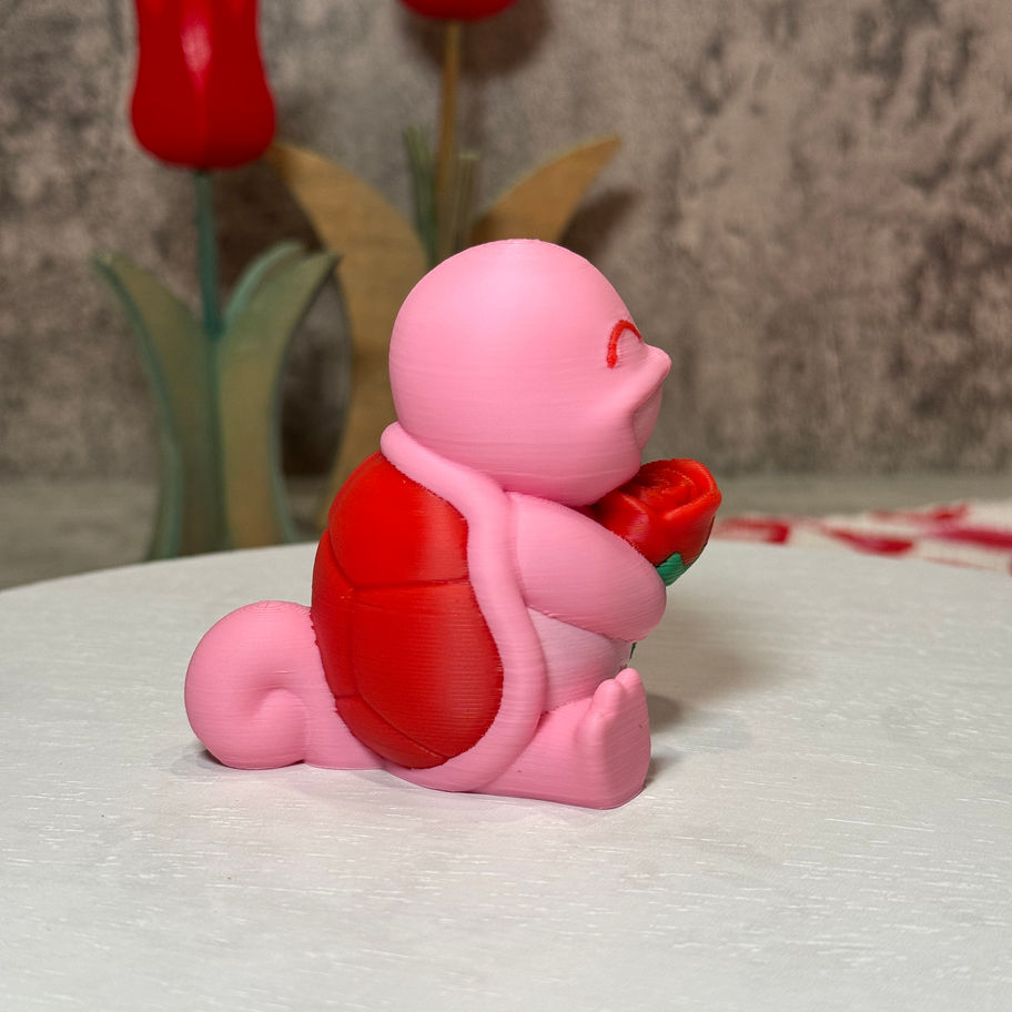 Got it! Here's the corrected alt text:  **Smiling pink Squirtle holding a red rose—adorably chill and full of Valentine vibes