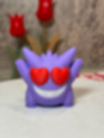 Purple Gengar with a giant grin and bold red heart eyes, arms raised in excitement and full Valentine’s Day spirit.