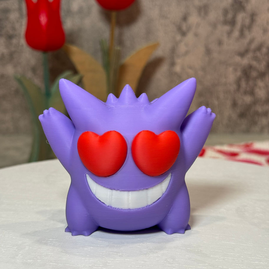 Purple Gengar with a giant grin and bold red heart eyes, arms raised in excitement and full Valentine’s Day spirit.