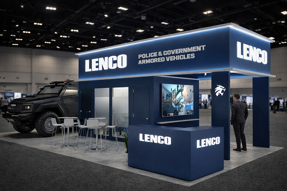 Exhibit booth with "LENCO" branding, police vehicle, and man in suit observing. Blue color scheme in a dimly-lit convention hall.