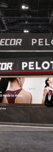 Precor Peloton booth with exercise screen and rowing machine