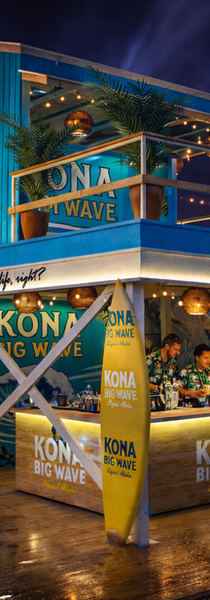 Kona Big Wave tropical booth at a night event