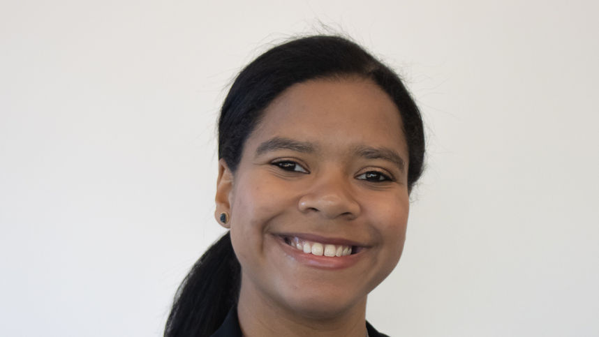 Image of a smiling female student indoors.