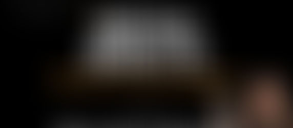 Beth Gress holding a camera with your next media minute episode 7, When are real estate photos and media delivered?