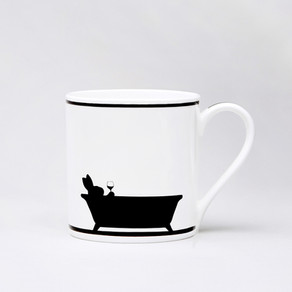 white ceramic mug with a silhouette design of a rabbit in the tub holding a glass of wine.