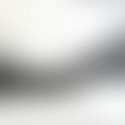 Graphite and charcoal abstract drawing by Douglas Gilbert of a suggestive mountain landscape formed by dense intersecting lines that gradually fade into the background.