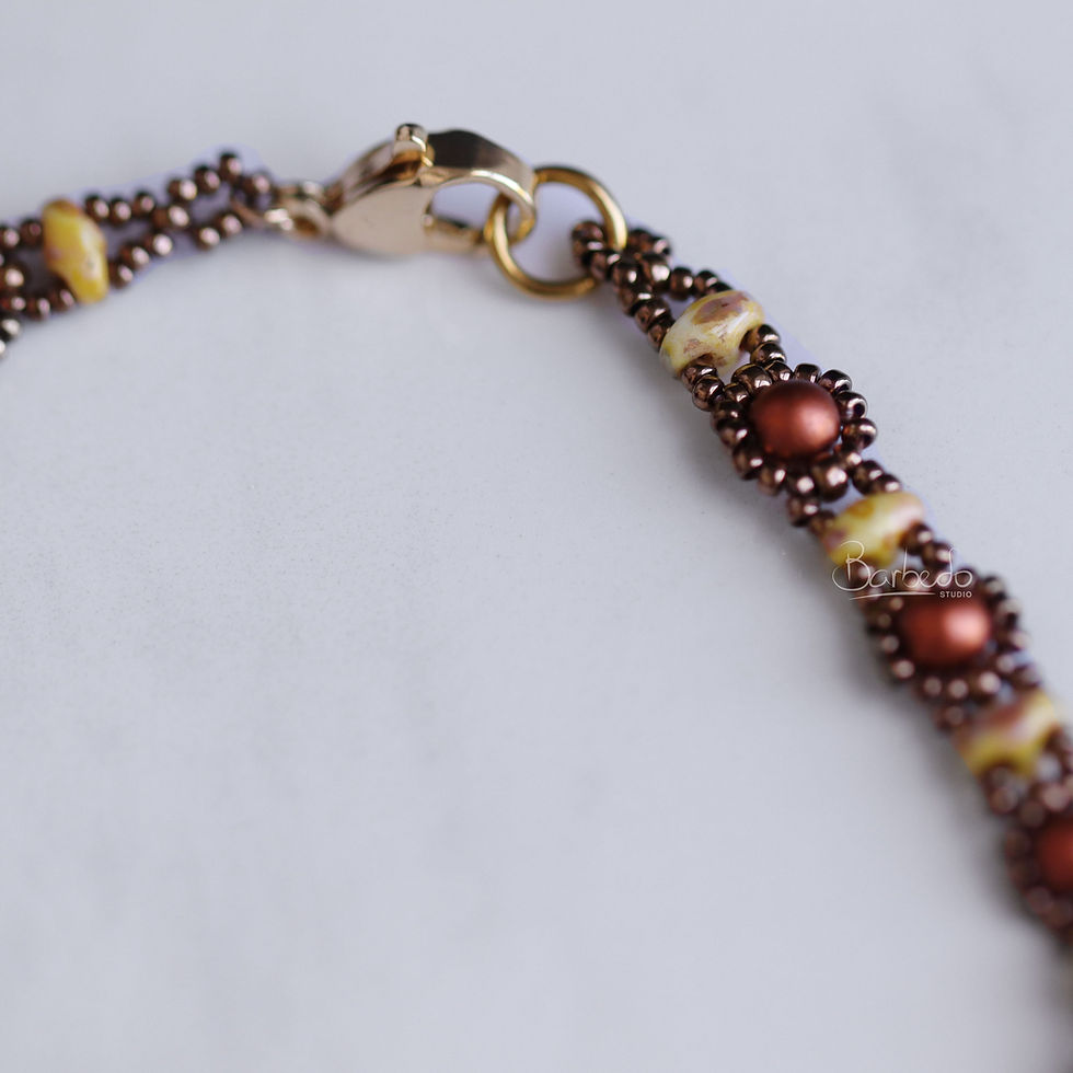 Thumbnail: claps of  19" Necklace with Picasso yellow and antique gold glass beads, and Copper Swarovski pearls, creating flower patterns. Necklace is weaved with beads all around.  At Lapin Curiosities.