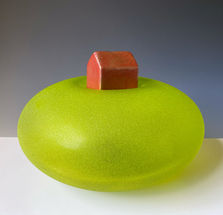 Lapin contemporary presents green textured glass sphere suggesting a hilltop, with bronze barn on top.