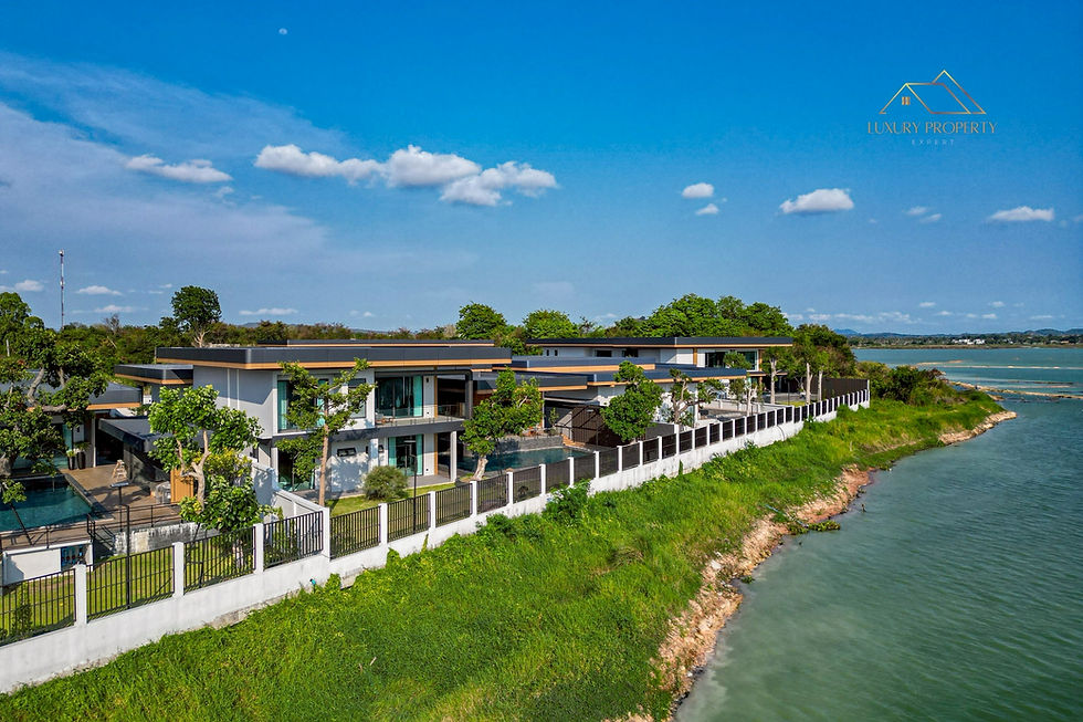 Aerial drone shot showcasing a bespoke estate situated directly on the shores of Chaknok Lake, emphasizing the prime location of these ultra luxury villas for sale Pattaya.