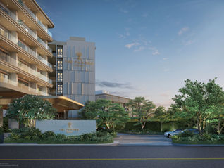 Exterior view of Panora Estuaria in Na Jomtien featuring sleek, modern beachfront architecture and lush tropical landscaping.